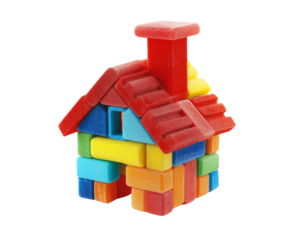 Colorful toy block house with red chimney on white background..