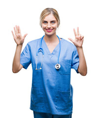 Young beautiful blonde doctor surgeon nurse woman over isolated background showing and pointing up with fingers number eight while smiling confident and happy.