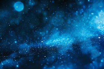 Abstract blue bokeh background with sparkling light effect, perfect for festive or cosmic themed designs.