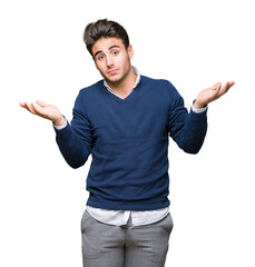 Fototapeta premium Young handsome business man over isolated background clueless and confused expression with arms and hands raised. Doubt concept.
