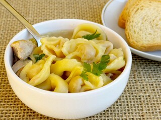 Soup. Italian tortellini soup (capeletti, agnolini) with chicken and vegetables. Special meal, starter or nutritious side dish or for a cold winter day.