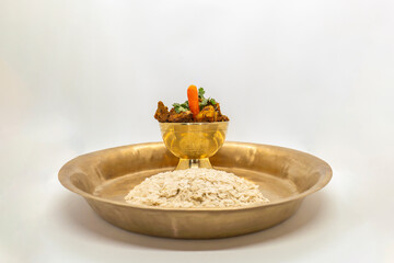 Delicious Flaky Rice and Fried Chicken Spicy Nepali masu chiura lunch on a plate chicken curry fried