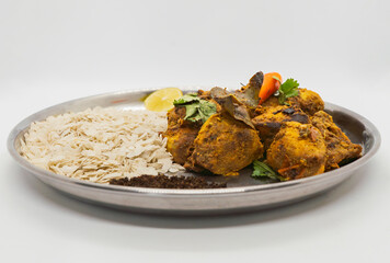Delicious Flaky Rice and Fried Chicken Spicy Nepali masu chiura lunch on a plate chicken curry fried