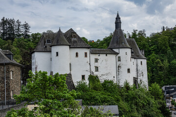 Fototapeta premium View of Clervaux Castle (Chateau de Clervaux) in Clervaux in Northern Luxembourg, dates back to XII century. Castle stands at a height of 365 meters on a rocky spur above town. Clervaux, Luxembourg.