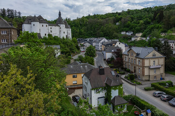 Fototapeta premium View of Clervaux Castle (Chateau de Clervaux) in Clervaux in Northern Luxembourg, dates back to XII century. Castle stands at a height of 365 meters on a rocky spur above town. Clervaux, Luxembourg.