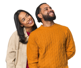Young Latino couple in studio relaxed and happy laughing, neck stretched showing teeth.