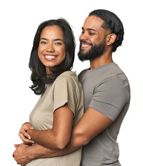 Latino couple in love embracing warmly in studio