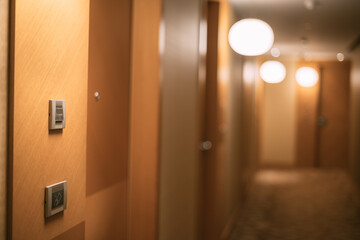 The empty, brightly lit corridor of the hotel. No one, no people.