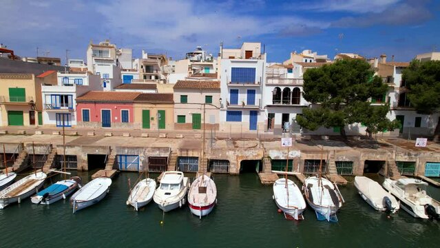Mallorca island landmarks. Scenic fishing village Portocolom with colorful houses and boats . Popular tourist destination. Balears, Spain. aerial 4k hd video