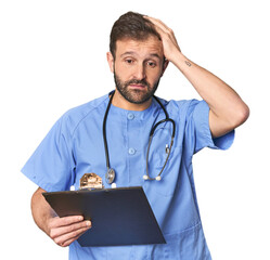 Hispanic male nurse with inventory being shocked, she has remembered important meeting.