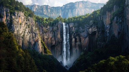 A dramatic waterfall tumbling into a deep gorge, with towering cliffs and dense forest on either side.