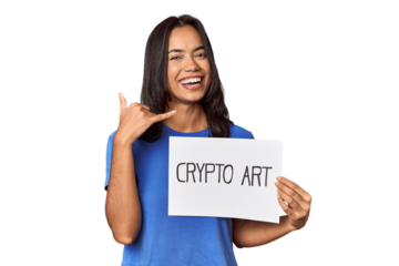 Woman with "crypto art" sign in studio showing a mobile phone call gesture with fingers.