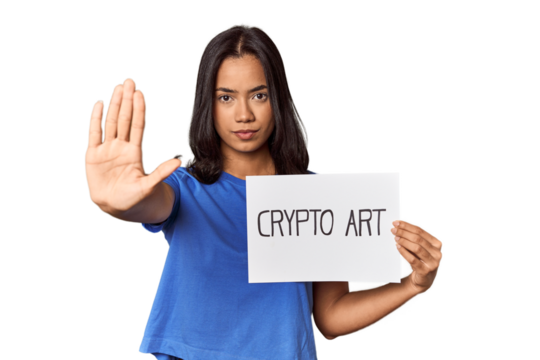 Woman with "crypto art" sign in studio standing with outstretched hand showing stop sign, preventing you.