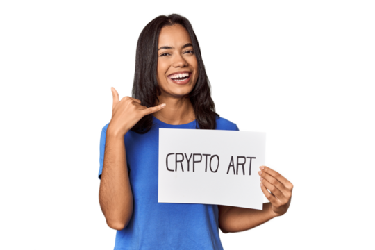 Woman with "crypto art" sign in studio showing a mobile phone call gesture with fingers.