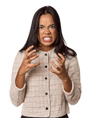Young filipino woman upset screaming with tense hands.