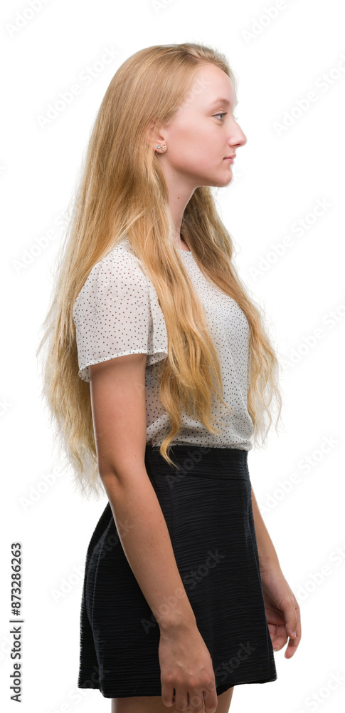 Poster blonde teenager woman wearing moles shirt looking to side, relax profile pose with natural face with