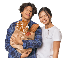 Multiracial young couple shopping for groceries in studio
