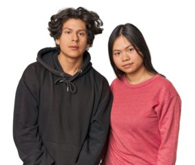 Multiracial young couple standing together in studio