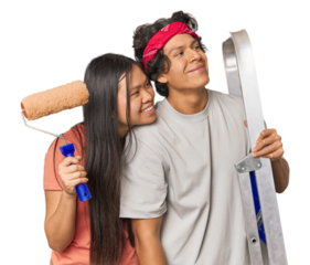 Multiracial couple ready to paint their new home in studio