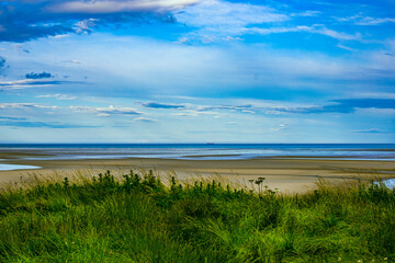 Dublin, Ireland - wetland beach under blue sky and white clouds