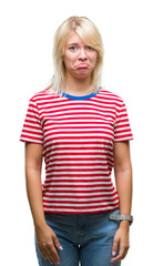 Fototapeta premium Young beautiful blonde woman over isolated background depressed and worry for distress, crying angry and afraid. Sad expression.