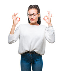 Fototapeta premium Young braided hair african american girl wearing glasses and sweater over isolated background relax and smiling with eyes closed doing meditation gesture with fingers. Yoga concept.