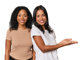 Young Latin friends in studio holding a copy space on a palm.
