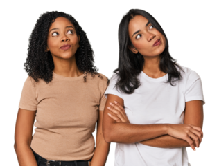 Young Latin friends in studio dreaming of achieving goals and purposes