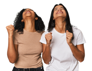 Young Latin friends in studio celebrating a victory, passion and enthusiasm, happy expression.