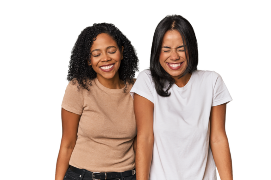 Young Latin friends in studio laughs and closes eyes, feels relaxed and happy.