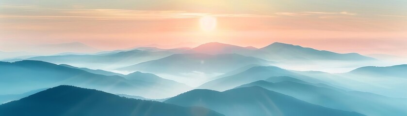 Obraz premium Stunning sunrise over misty blue mountains, capturing the serene beauty of nature with warm hues and soft light.