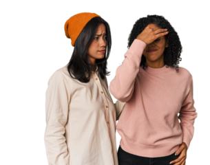 Young Latin friends together in studio having a head ache, touching front of the face.