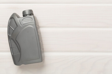 Machine oil on wooden background, top view