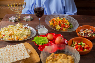 The table is festively set with matzo and kearah for the Pesach Seder holiday