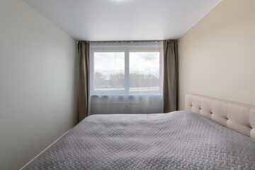 Minimalism Children, Young Adult Living Room Interior. Gray Blanket on the Bed. Windows and Curtains. LED Light
