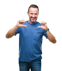 Fototapeta premium Middle age hoary senior man over isolated background looking confident with smile on face, pointing oneself with fingers proud and happy.