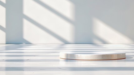 Minimalistic white platform in bright sunlight with geometric shadows on an empty floor, ideal for showcasing products or designs.