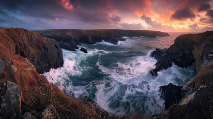 the ocean waves crashing against the rocks at sunset
