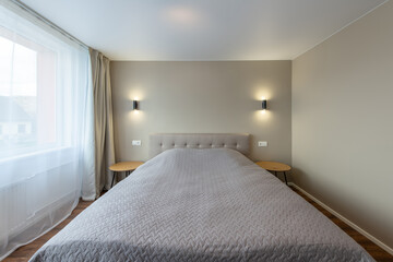 Minimalism Bedroom Interior. Wardrobe in Background. Coffee Table and Light. Windows and Curtains. Home.