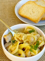 Soup. Italian tortellini soup (capeletti, agnolini) with chicken and vegetables. Special meal, starter or nutritious side dish or for a cold winter day.