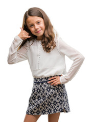 Brunette hispanic girl smiling doing phone gesture with hand and fingers like talking on the telephone. Communicating concepts.