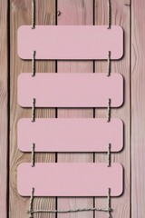 4 light pink wooden slats on the wall, 4 blank horizontal signs hanging side by side in the style of side. The background is a textured wood paneling surface.