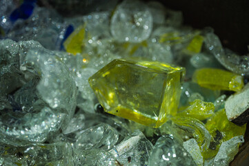 broken glass, multicolored particles, close-up view, background, selective focus