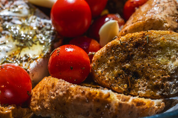 Camembert cheese with vegetables, cherry tomatoes, spices, bread, croutons and garlic, quick snack,...