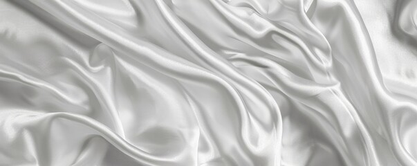 Obraz premium Close-up of smooth, flowing white satin fabric creating elegant folds and luxurious texture, perfect for backgrounds or textile
