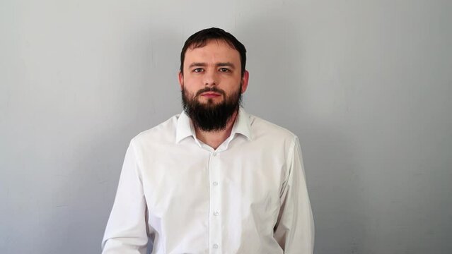 Man Signaling to Be Quiet with Finger to Lips And Stop Talking. Silence gesture