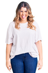 Obraz premium Young caucasian woman wearing casual clothes sticking tongue out happy with funny expression. emotion concept.
