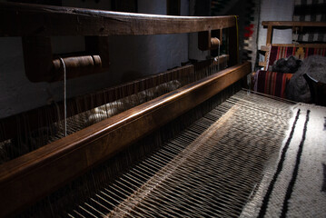 Close-up of a loom in the process of creating a wool product
