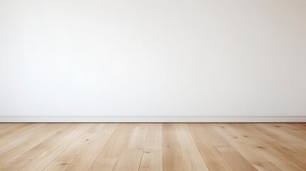 Empty room with wooden floor and white wall.