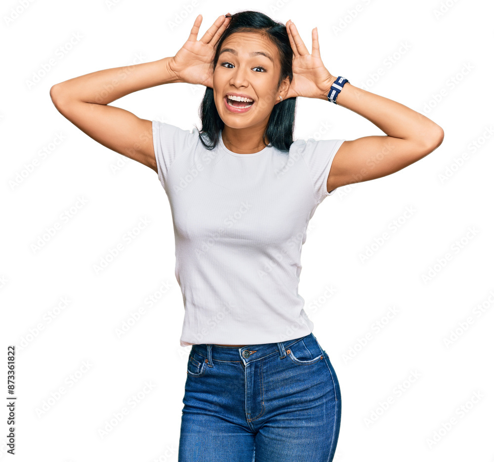 Sticker beautiful hispanic woman wearing casual white tshirt smiling cheerful playing peek a boo with hands 